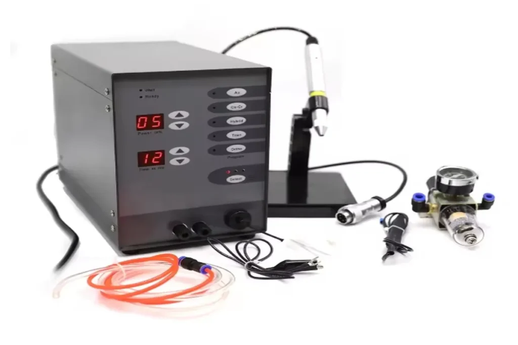 Flat lay of permanent jewelry tools, welding machine, and supplies — complete starter kit for making custom permanent bracelets and anklets.