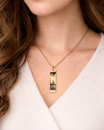 Gold Personalized Eye Photo Necklace with black and white engraved image on bar pendant