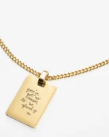 A close-up of a custom necklace featuring intricate handwriting engraving, highlighting its fine details and craftsmanship.