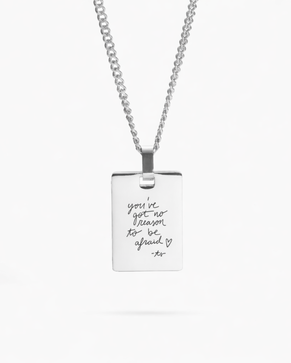 A sleek sterling silver necklace with a beautifully engraved handwritten message, offering a timeless and personal touch