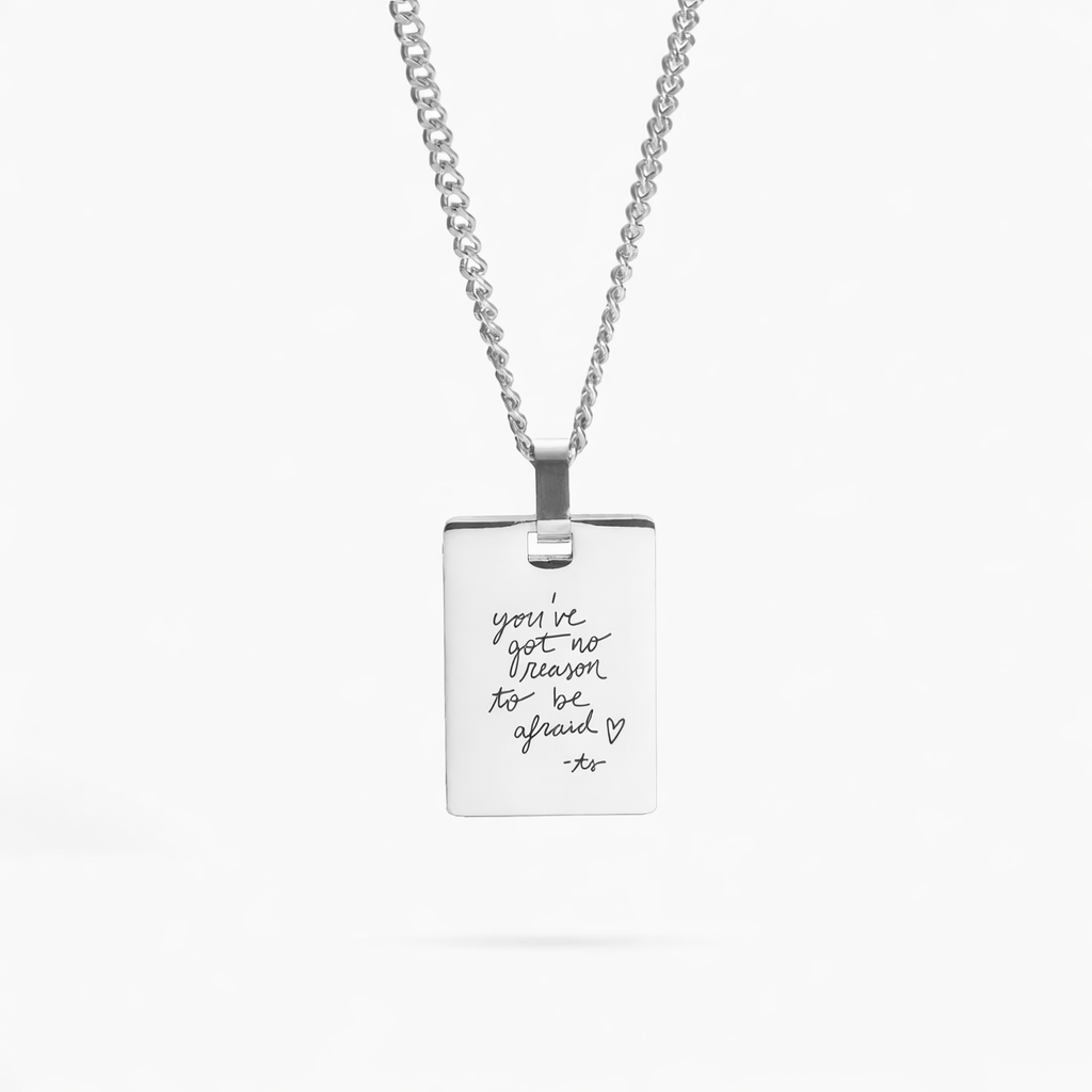 A sleek sterling silver necklace with a beautifully engraved handwritten message, offering a timeless and personal touch