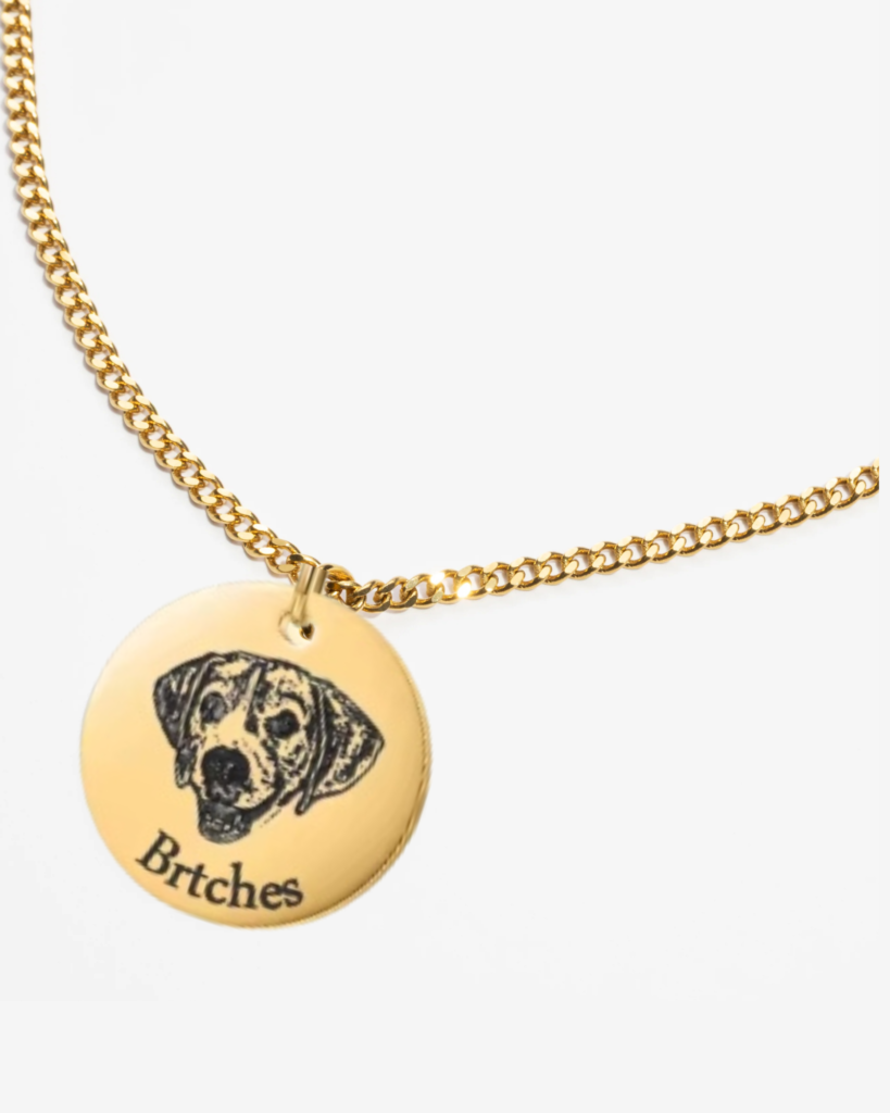 Close-up of a personalized dog portrait photo necklace, highlighting the intricate engraving and craftsmanship.