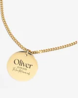 Close-up of a custom necklace with finely engraved text, highlighting the detail and craftsmanship of the design.