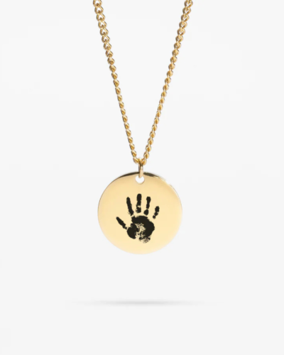 Engraved Baby Handprint Necklace with custom name and birth date.