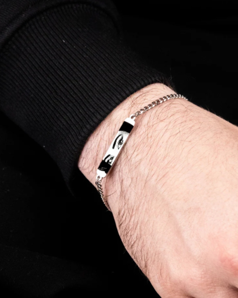 Man wearing a personalized bracelet with engraved woman’s eye photo