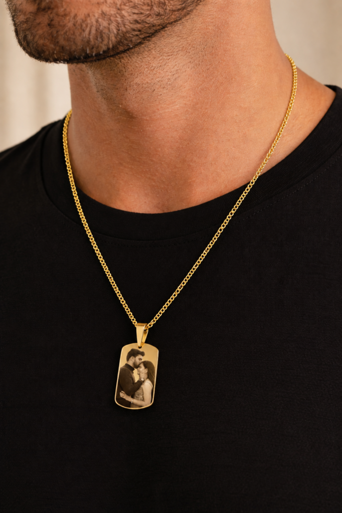 Male model wearing custom gold photo necklace with hidden message QR code pendant, modern personalized jewelry