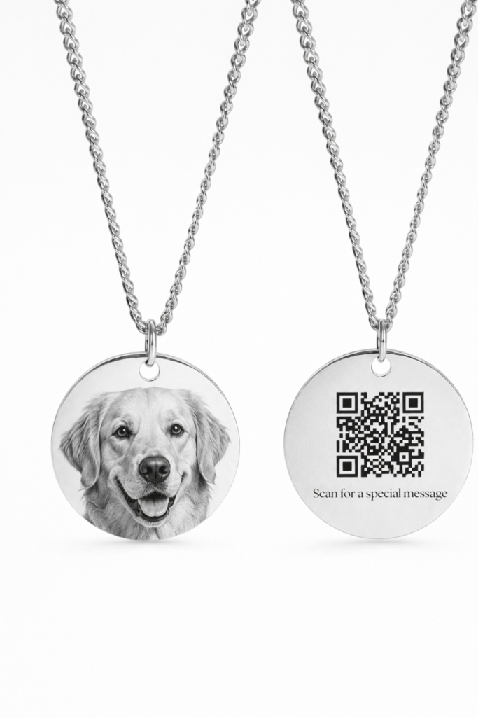 Silver circular necklace featuring a custom engraved dog portrait on the front and a QR code on the back that reveals a hidden message when scanned.