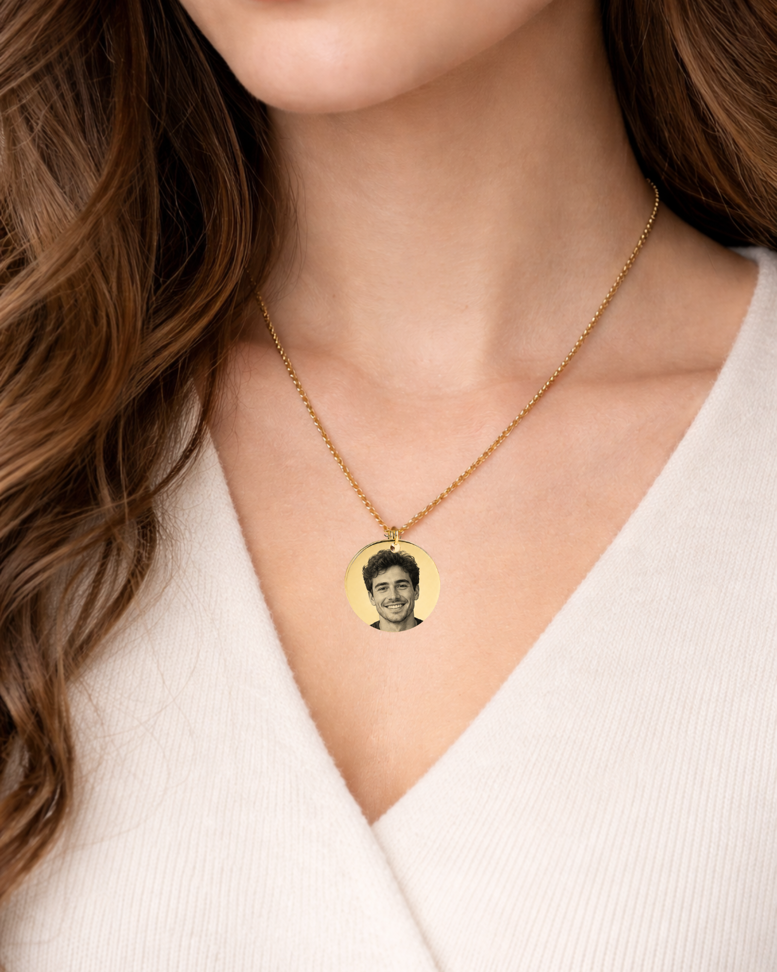 Close-up photo of a woman wearing a silver round pendant necklace engraved with a man detailed Golden Retriever a portrait. The necklace is displayed on a soft neutral outfit with natural lighting,