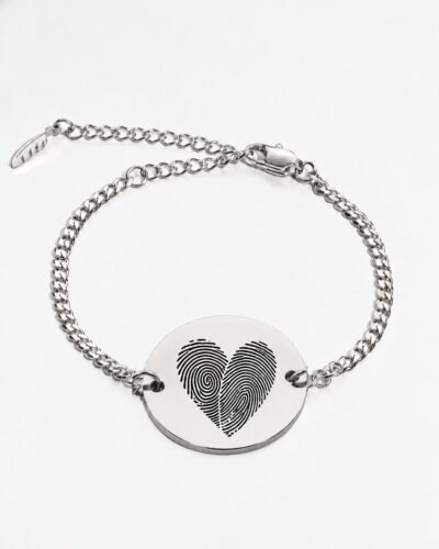 Two fingerprint bracelet in silver — two actual fingerprints engraved as a heart on a round disc, Cuban chain bracelet with lobster clasp and extender. Personalized couples fingerprint bracelet in stainless steel.