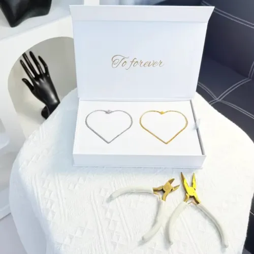 Close-up of DIY Permanent Bracelet Kit with gold and silver chains, showing tools and packaging for couples jewelry making.