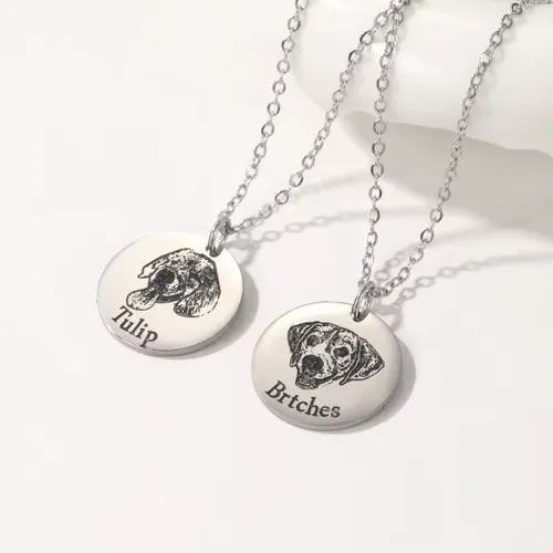 Personalized dog portrait photo necklace engraved with a custom dog image on a silver pendant.